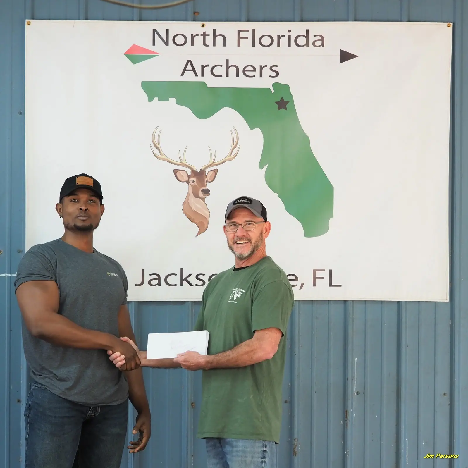 Archery club handshake, North Florida sign.