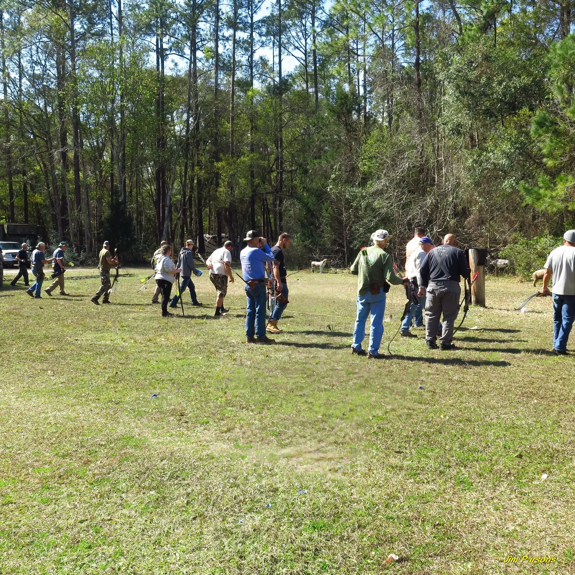 People walking in a grassy field