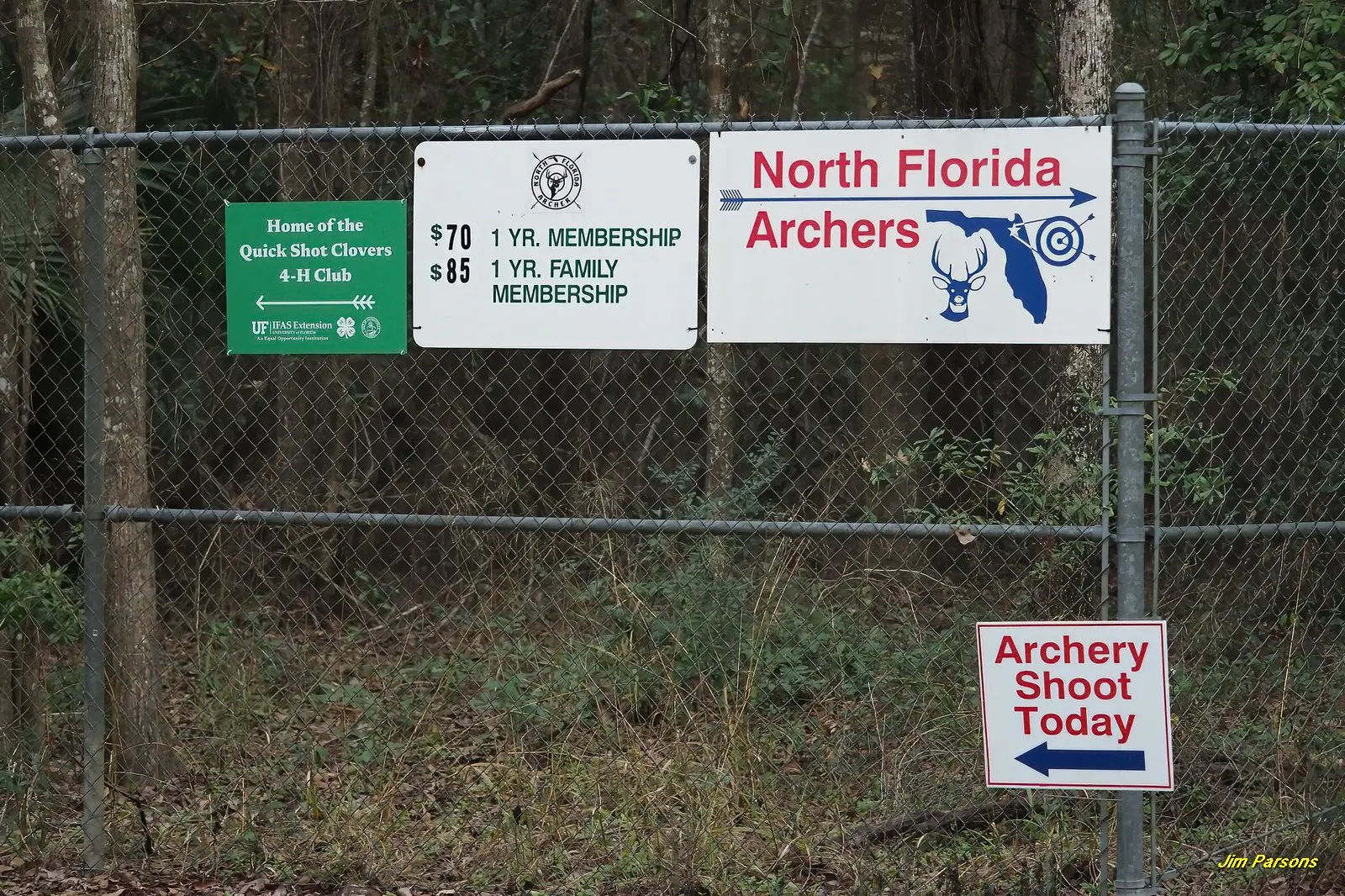 Sign for North Florida Archers and archery range information.