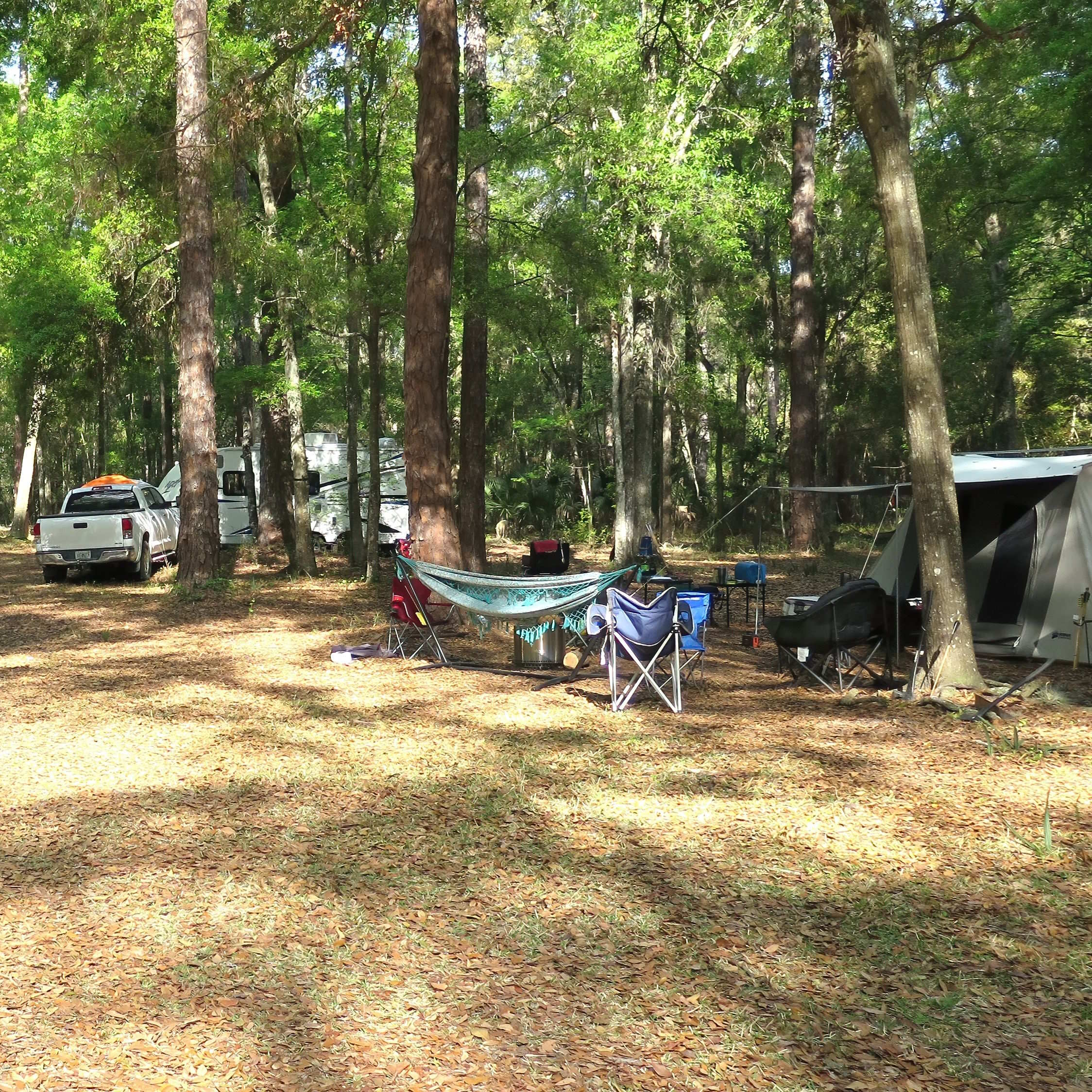 Camping site with chairs and hammock